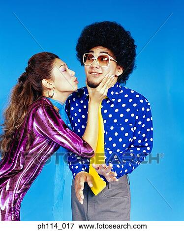 Young woman seducing man with afro hair View Large Photo Image Stock Photo - Young woman seducing man with afro hair. Fotosearch