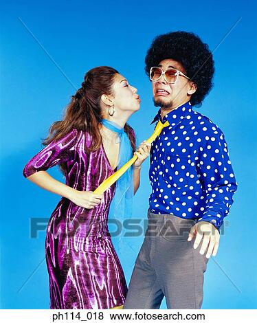 Young woman seducing man with afro hair View Large Photo Image Stock Photo - Young woman seducing man with afro hair. Fotosearch