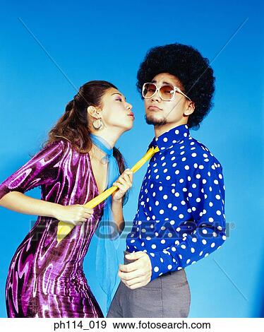 Young woman seducing man with afro hair View Large Photo Image Stock Photo - Young woman seducing man with afro hair. Fotosearch