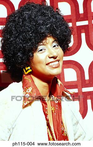 Picture - Portrait of a woman smiling with an Afro . Fotosearch