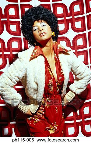 Stock Photograph - Portrait of a woman with an Afro . Fotosearch