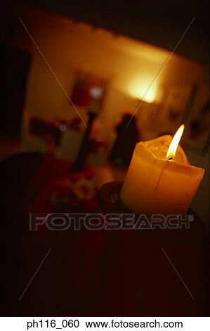Burning candle in living room, close up View Large Photo Image Stock Image - Burning candle in living room, close up. Fotosearch