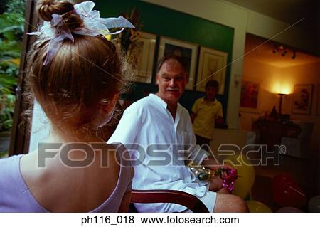 Father and children in living room View Large Photo Image Stock Photo - Father and children in living room. Fotosearch