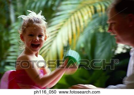 Portrait of father and daughter playing View Large Photo Image Stock Image - Portrait of father and daughter playing. Fotosearch