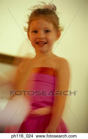 Young girl in pink costume, smiling View Large Photo Image Picture - Young girl in pink costume, smiling. Fotosearch