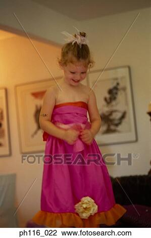 Young girl in pink costume, smiling View Large Photo Image Stock Image - Young girl in pink costume, smiling. Fotosearch