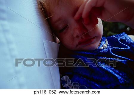 Young girl rubbing her eyes View Large Photo Image Stock Image - Young girl rubbing her eyes. Fotosearch