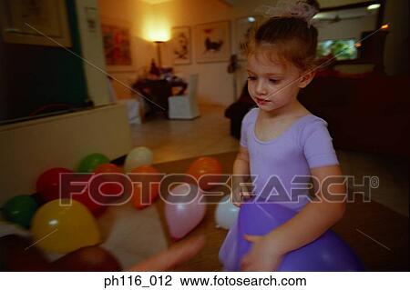 Young girl surrounded by balloons View Large Photo Image Stock Image - Young girl surrounded by balloons. Fotosearch