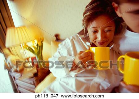 Stock Photo - Couple on bed. Fotosearch
