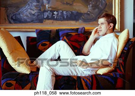 Stock Photo - Portrait of a Caucasian man listening to music. Fotosearch