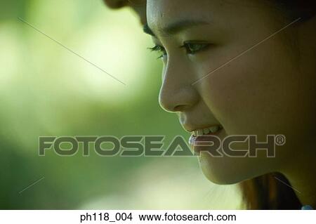 Picture - Side profile of a young woman. Fotosearch
