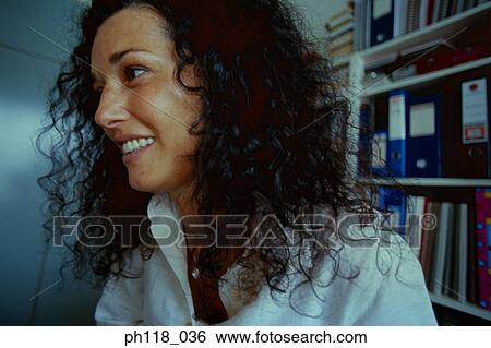 Stock Photograph - Side profile of a young woman. Fotosearch