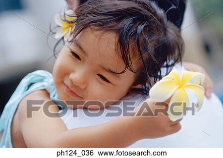 Stock Photograph - Father carrying daughter, close-up. Fotosearch