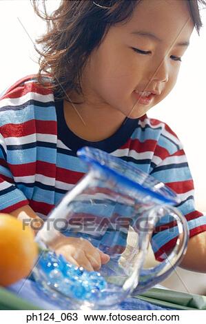 Stock Image - Portrait of a young Asian girl, close-up. Fotosearch