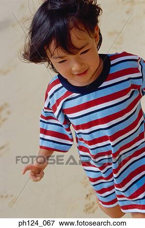 Portrait of a young Asian girl, close-up View Large Photo Image Stock Photo - Portrait of a young Asian girl, close-up. Fotosearch