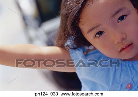 Stock Image - Portrait of a young Asian girl. Fotosearch