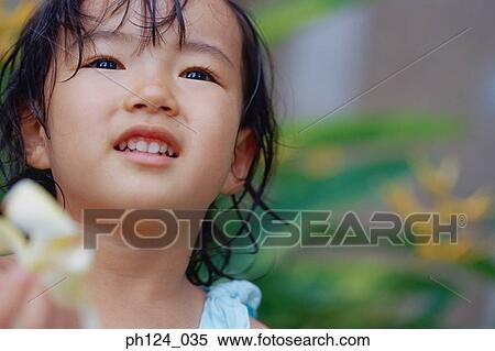 Stock Photography - Portrait of a young Asian girl. Fotosearch