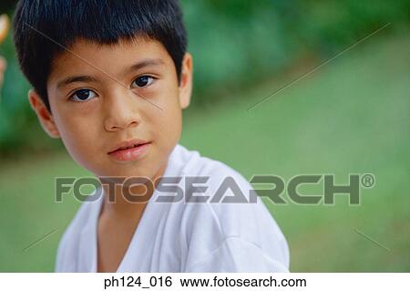 Stock Photograph - Young Asian boy, portrait. Fotosearch