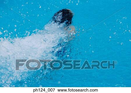 Stock Photo - Young Asian boy swimming in the pool. Fotosearch