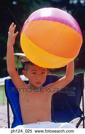 Young Asian boy with beach ball View Large Photo Image Stock Photography - Young Asian boy with beach ball. Fotosearch