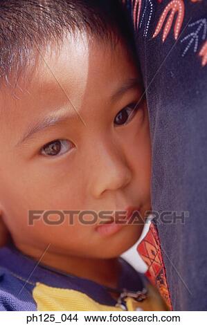 Picture - Close-up of a young Asian boy. Fotosearch