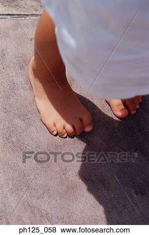 Feet of a young girl View Large Photo Image Stock Photo - Feet of a young girl. Fotosearch