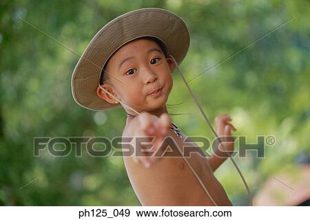Stock Photo - Portrait of a young Asian boy, close-up. Fotosearch