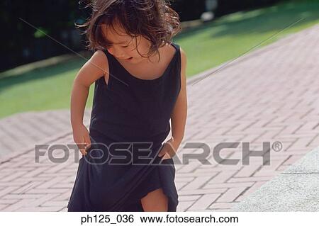 Portrait of a young Asian girl, close-up View Large Photo Image Stock Photograph - Portrait of a young Asian girl, close-up. Fotosearch