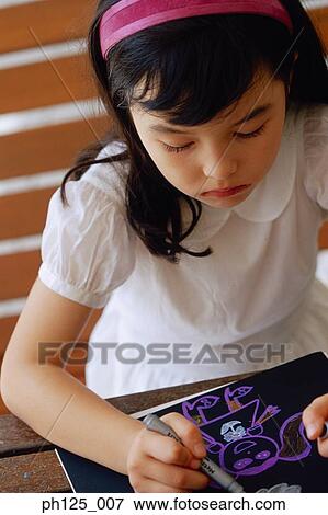 Stock Photo - Portrait of a young girl drawing. Fotosearch