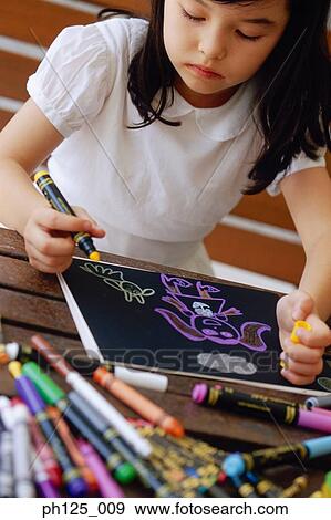 Stock Photo - Portrait of a young girl drawing. Fotosearch