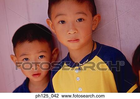Stock Image - Portrait of two brothers, close-up. Fotosearch