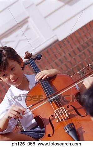 Young Asian boy playing cello View Large Photo Image Stock Photo - Young Asian boy playing cello. Fotosearch