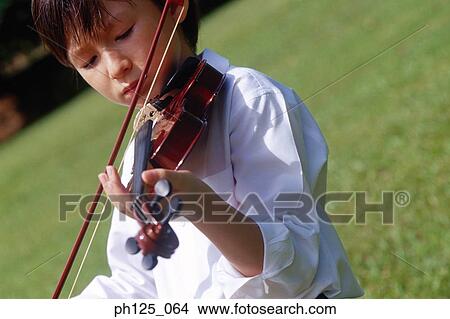 Young Asian boy playing violin View Large Photo Image Picture - Young Asian boy playing violin. Fotosearch