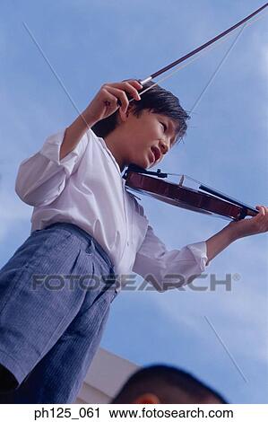 Young Asian boy playing violin View Large Photo Image Stock Image - Young Asian boy playing violin. Fotosearch