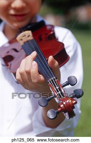 Young boy playing violin View Large Photo Image Stock Photography - Young boy playing violin. Fotosearch