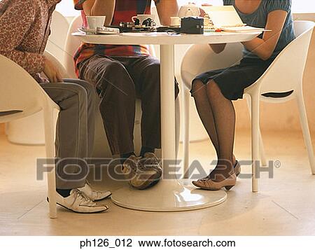 People at a café, view of lower section View Large Photo Image Stock Image - People at a café, view of lower section. Fotosearch