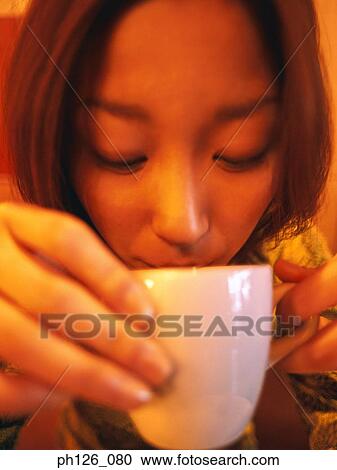 Young woman drinking from coffee cup, close-up View Large Photo Image Stock Image - Young woman drinking from coffee cup, close-up. Fotosearch
