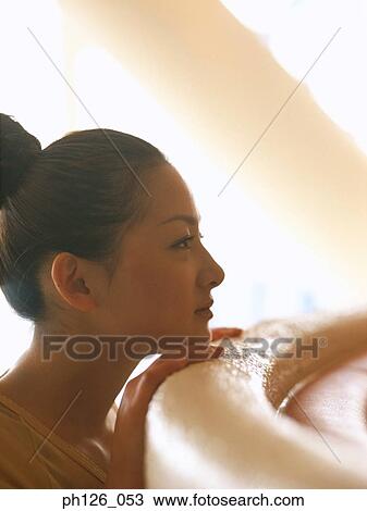 Young woman resting her chin on leather counter View Large Photo Image Stock Image - Young woman resting her chin on leather counter. Fotosearch