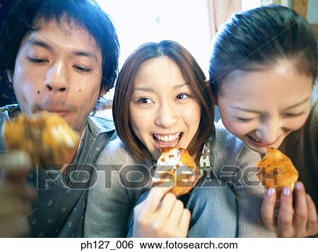 Friends eating snacks View Large Photo Image Stock Photograph - Friends eating snacks. Fotosearch