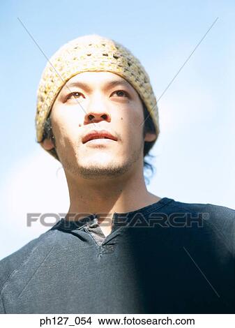 Picture - Portrait of a young Asian man. Fotosearch