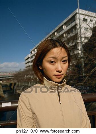 Stock Image - Portrait of a young Asian woman. Fotosearch