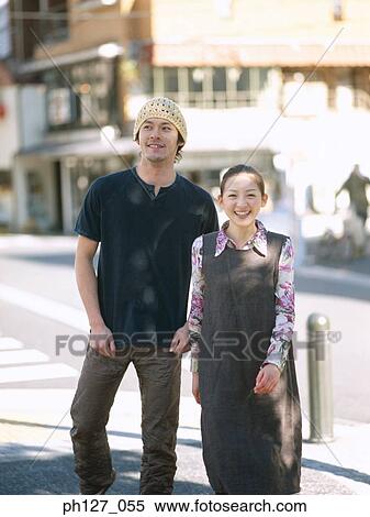 Young couple, smiling View Large Photo Image Stock Photography - Young couple, smiling. Fotosearch