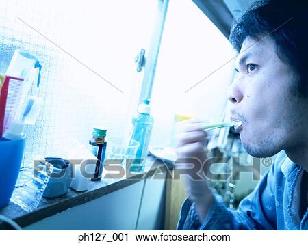 Young man brushing his teeth View Large Photo Image Stock Image - Young man brushing his teeth. Fotosearch