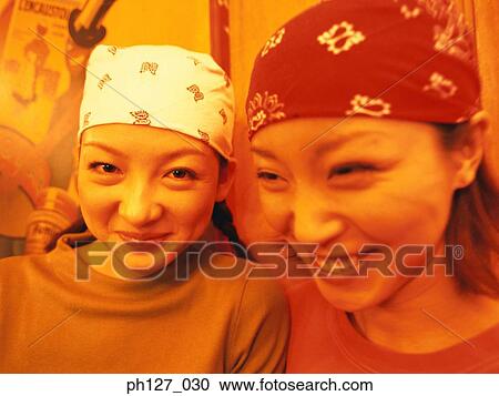 Stock Image - Young women wearing bandana. Fotosearch