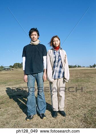 A young Asian couple View Large Photo Image Stock Photo - A young Asian couple . Fotosearch