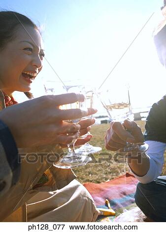 Stock Photo - Friends cheering. Fotosearch