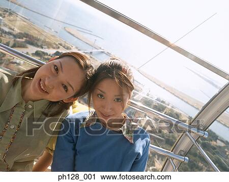 Stock Image - Portrait of two young women. Fotosearch