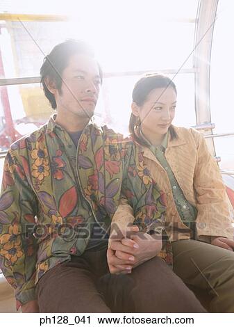 Portrait of Young couple holding hands View Large Photo Image Stock Image - Portrait of Young couple holding hands. Fotosearch