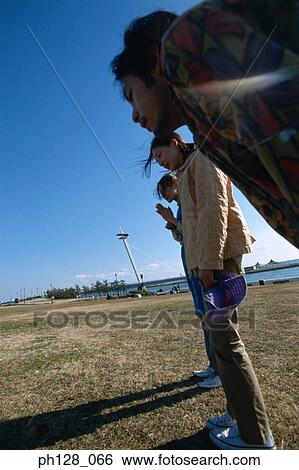Silhouette of three people standing View Large Photo Image Stock Photograph - Silhouette of three people standing . Fotosearch