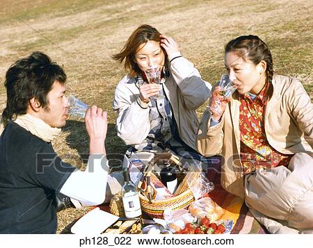 Three friends having picnic View Large Photo Image Stock Image - Three friends having picnic. Fotosearch